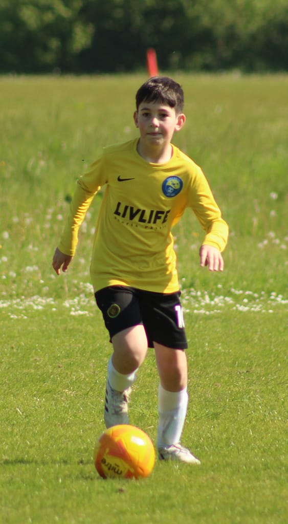 Boy footballer playing in Kings Hill, Kent